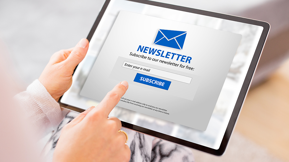 Woman subscribing to newsletter online